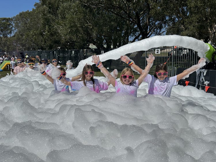 students in a pool of bubbles