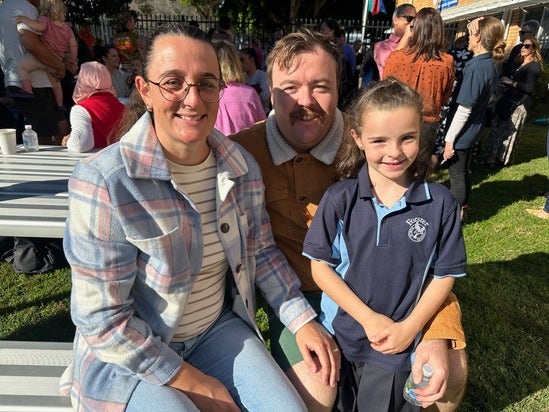 student with her parents