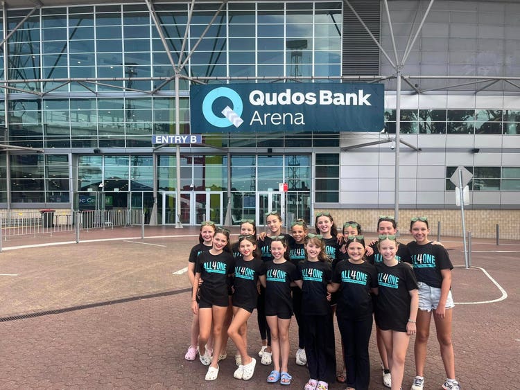 group of girls outside arena