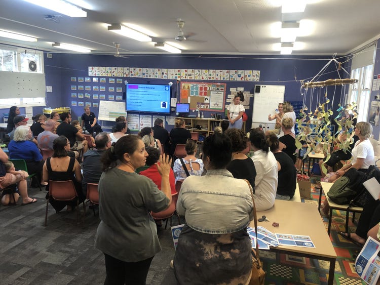 parents and students in classroom information session